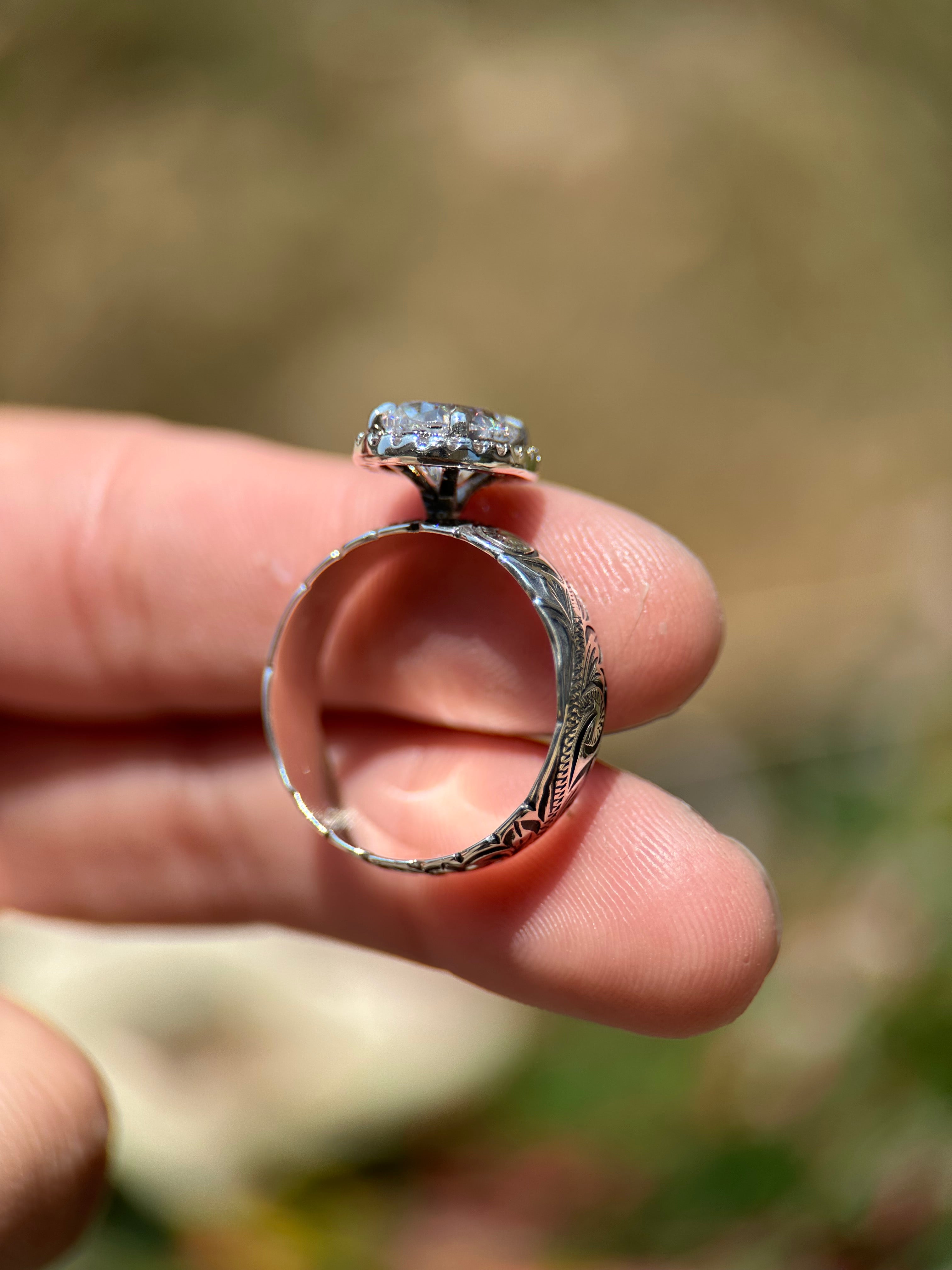 OVAL HALO ENGAGEMENT RING.