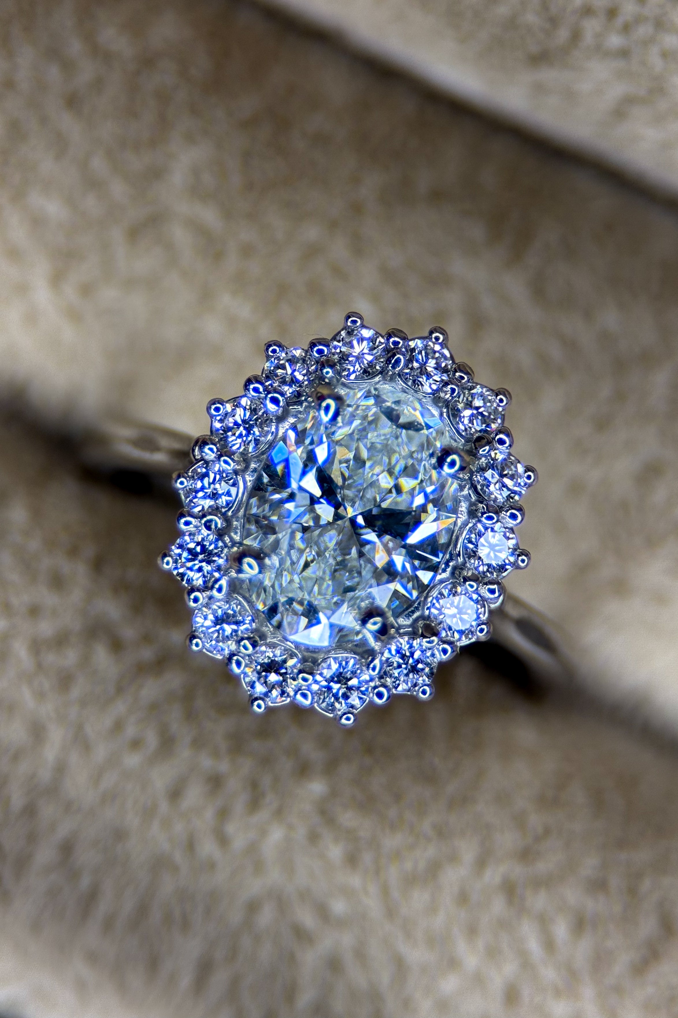 14K WHITE GOLD FANCY OVAL HALO SET.