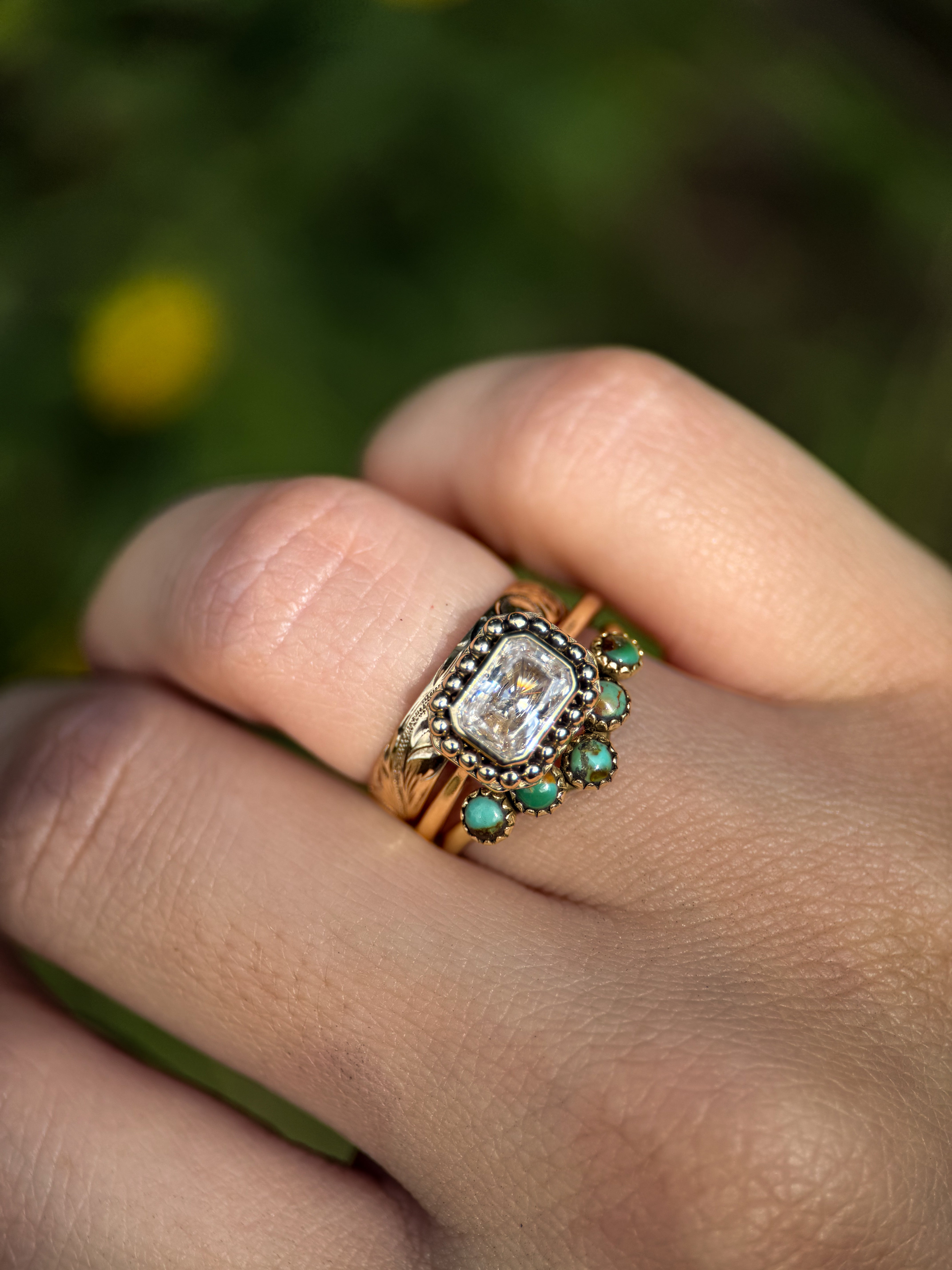 EAST WEST EMERALD MOISSANITE 14k YELLOW GOLD SET.