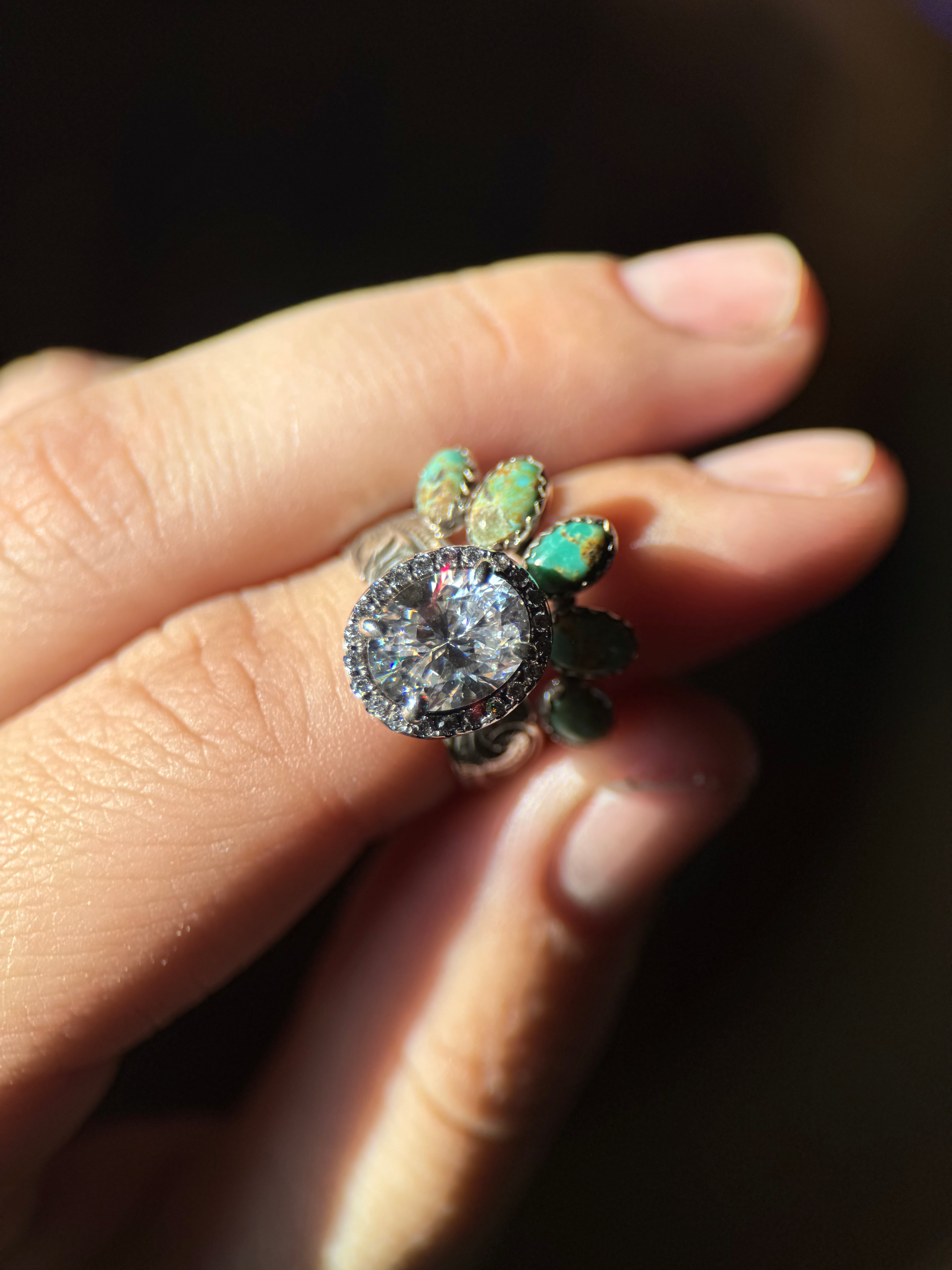 OVAL HALO ENGAGEMENT RING.