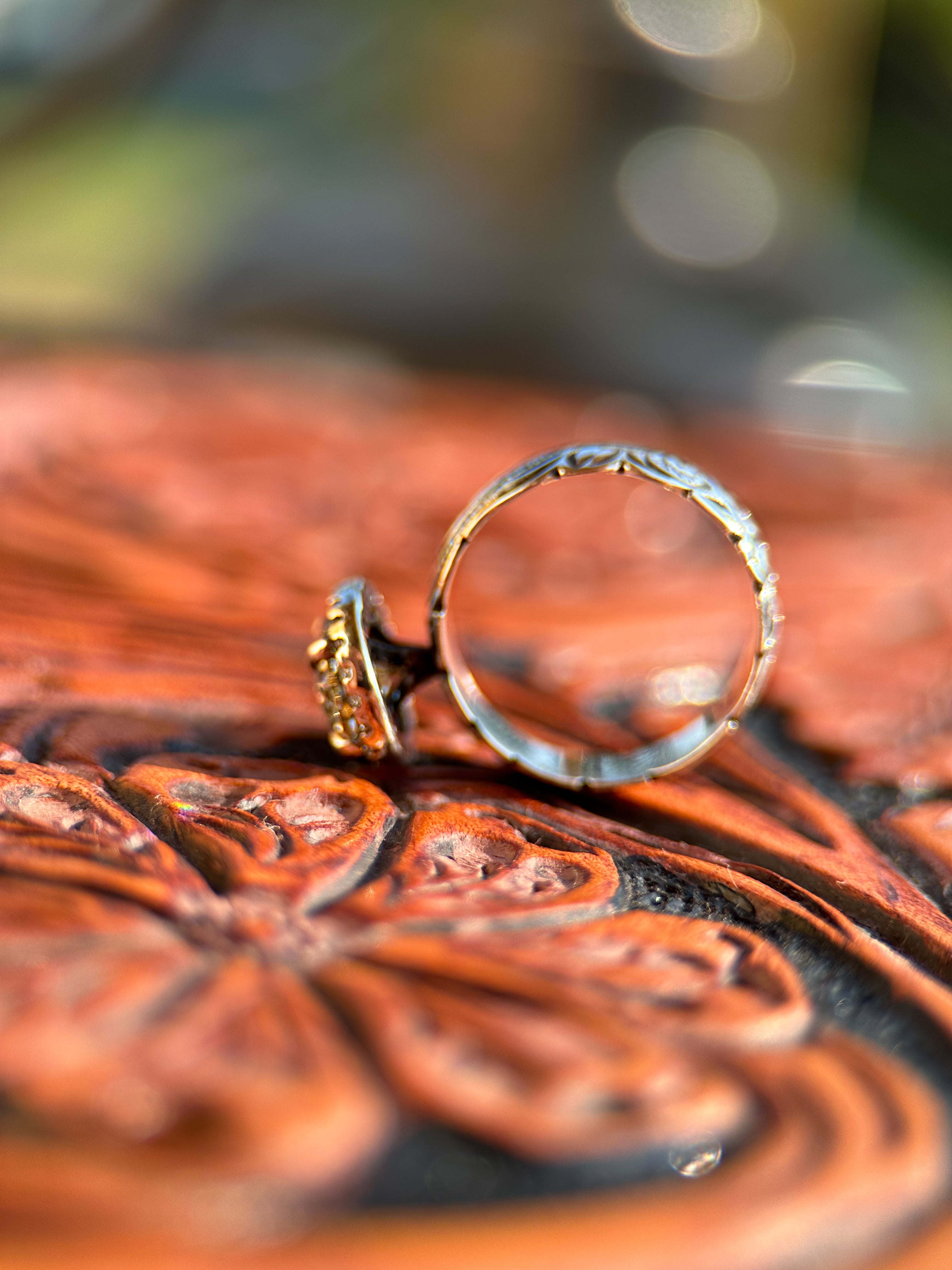 OVAL HALO ENGAGEMENT RING.