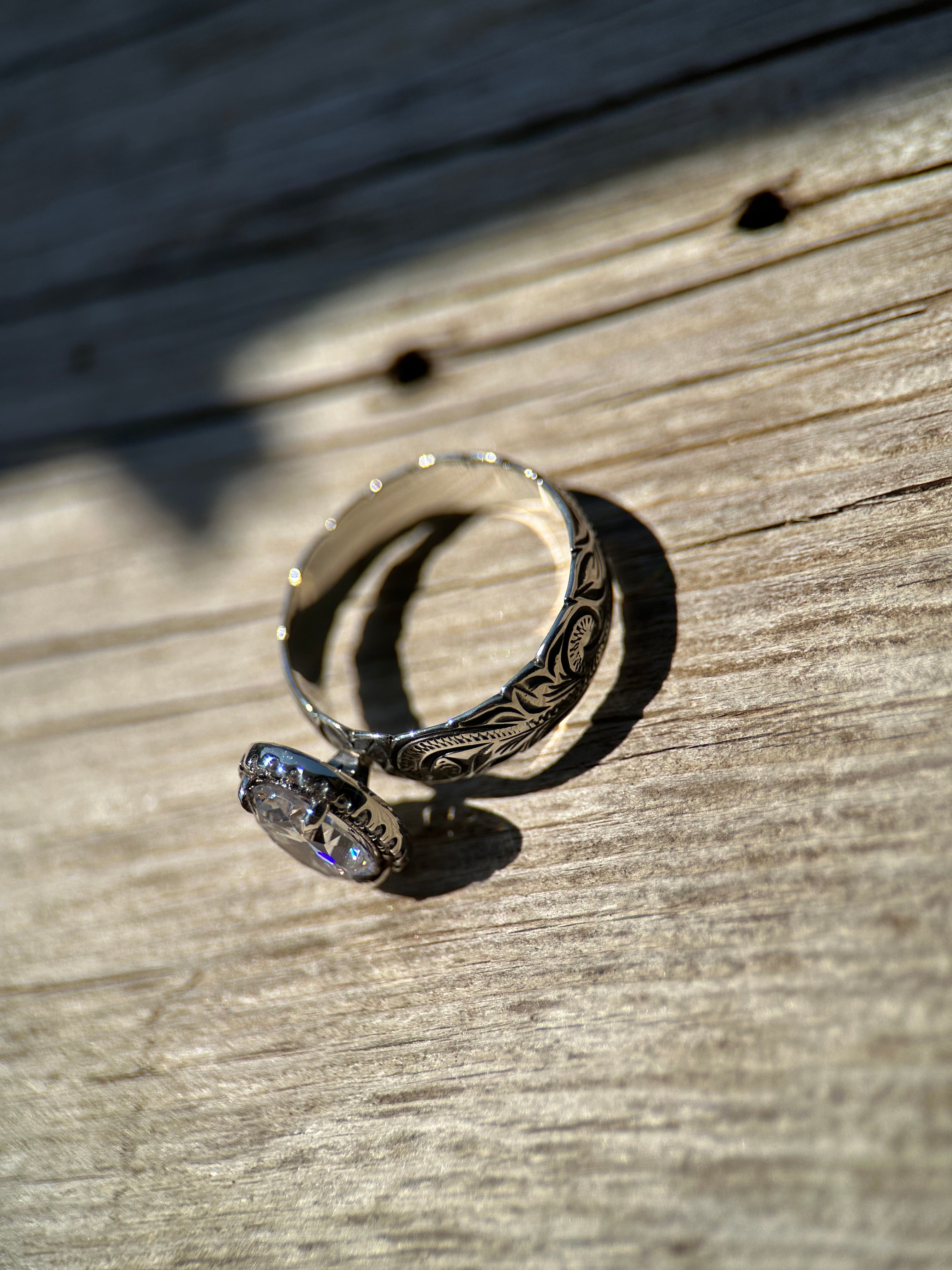 OVAL HALO ENGAGEMENT RING.