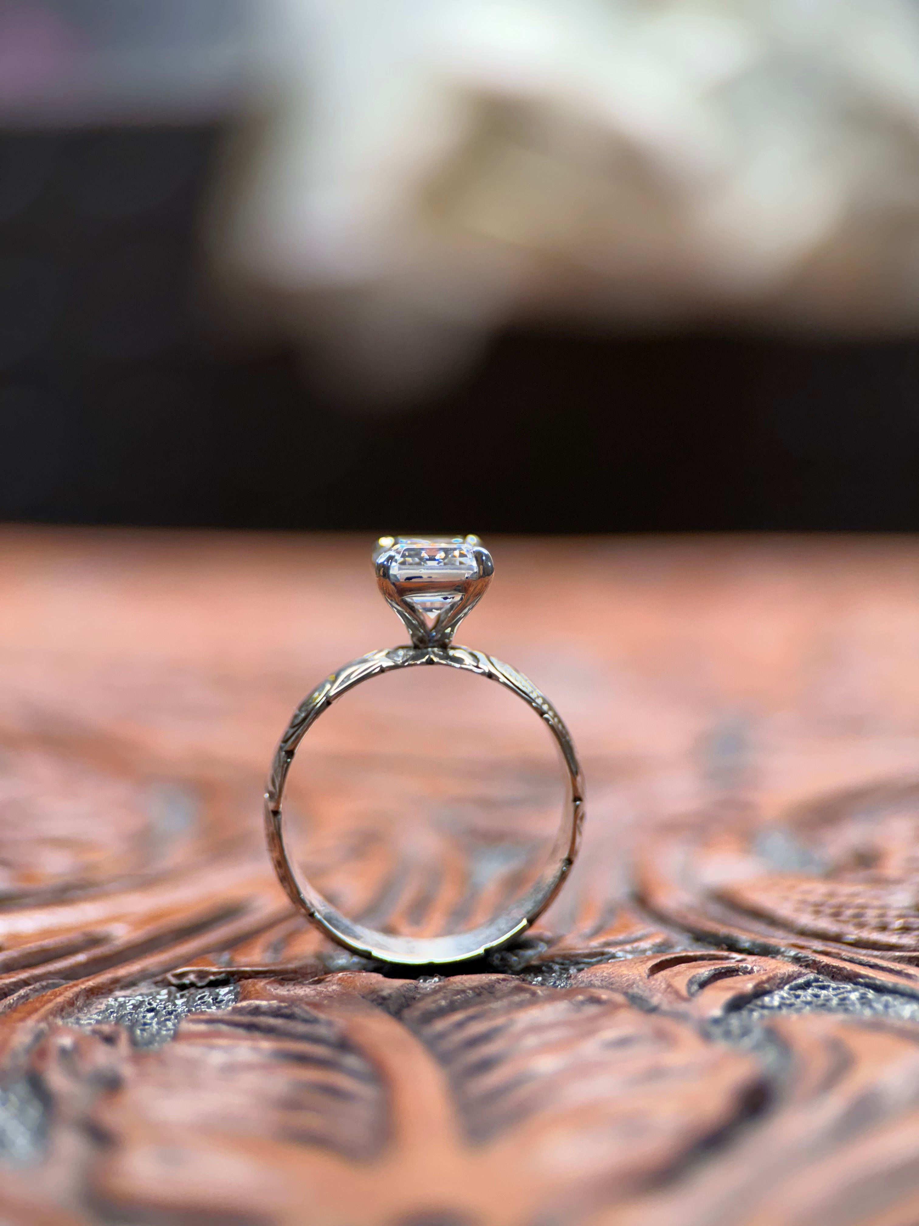 EMERALD SOLITAIRE ENGAGEMENT RING.