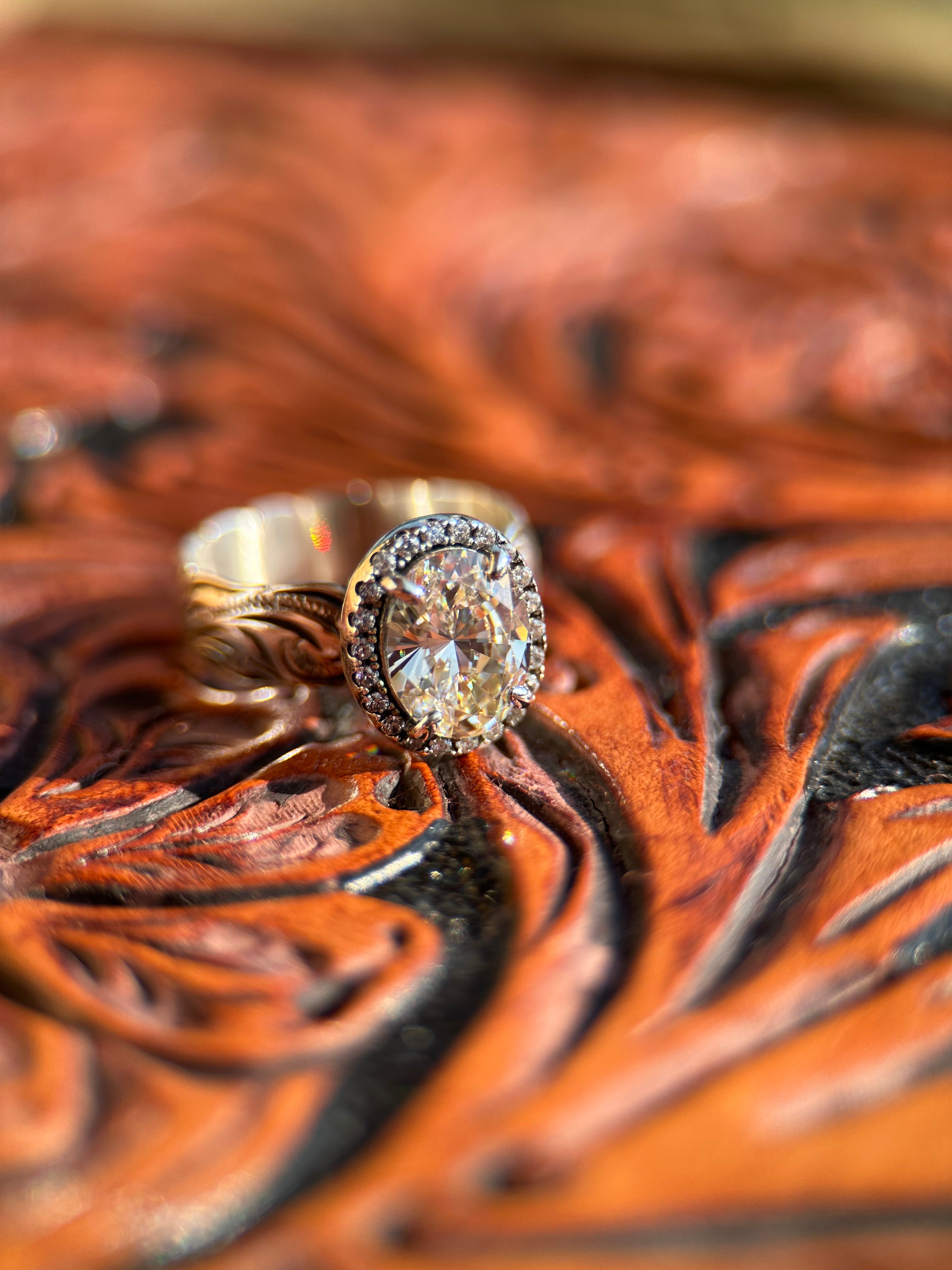 OVAL HALO ENGAGEMENT RING.