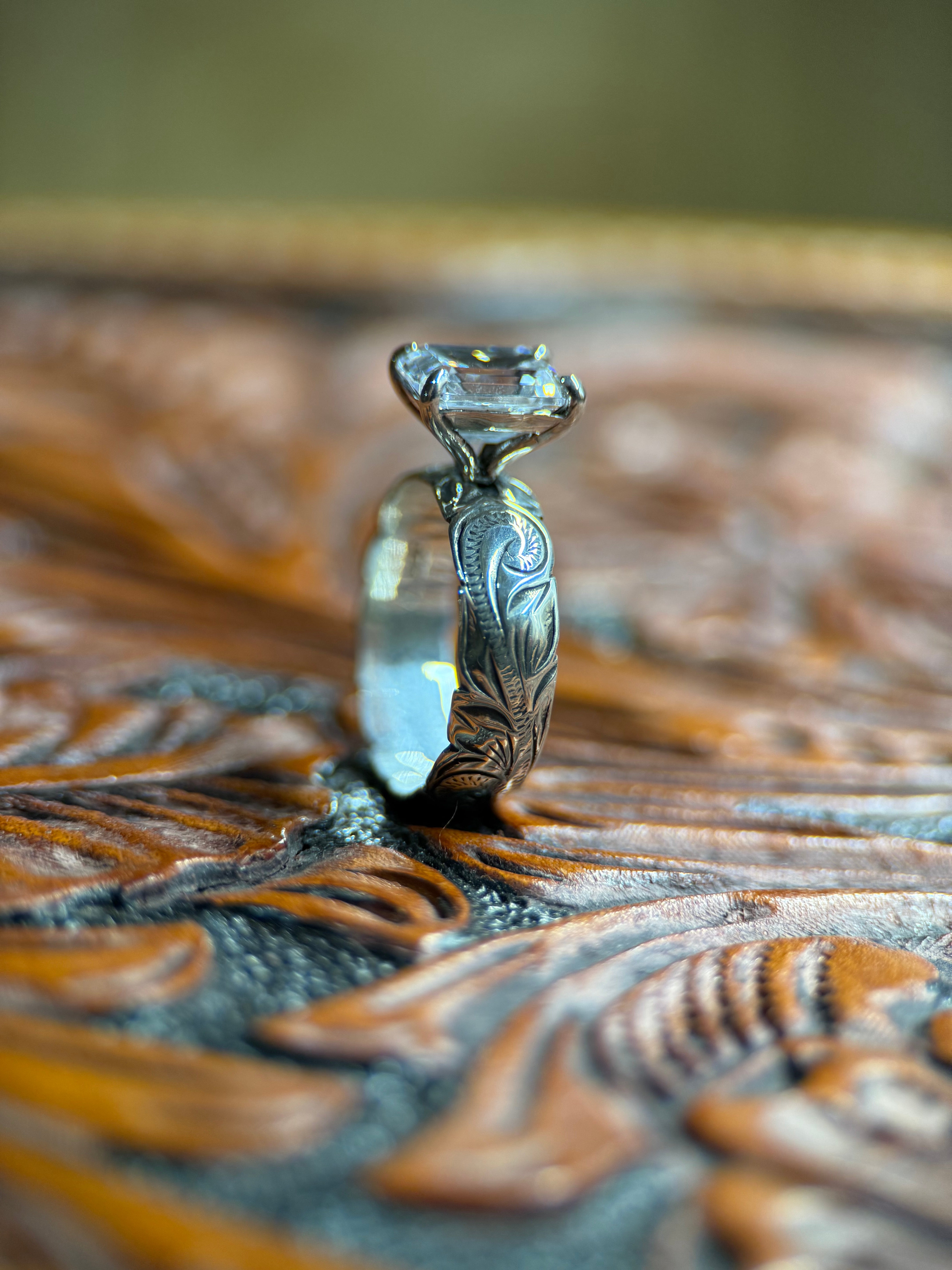 EMERALD SOLITAIRE ENGAGEMENT RING.
